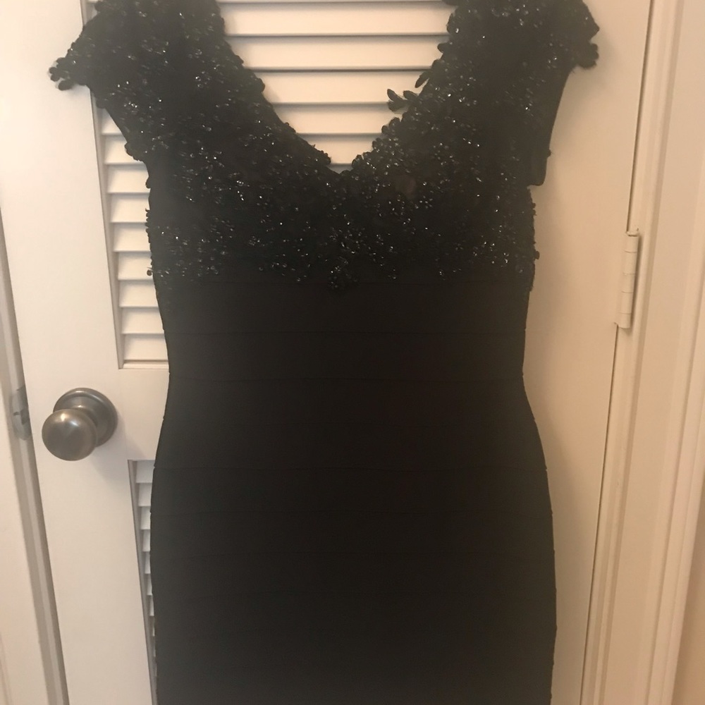 Black sequined body con holiday dress
